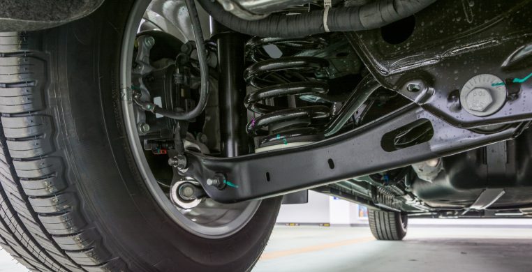 Technical photo. The structure of the modern car. Rear suspension. Shock absorber. Spring suspension. Technical photo. The structure of the modern car. Rear suspension. Shock absorber. Spring suspension.
